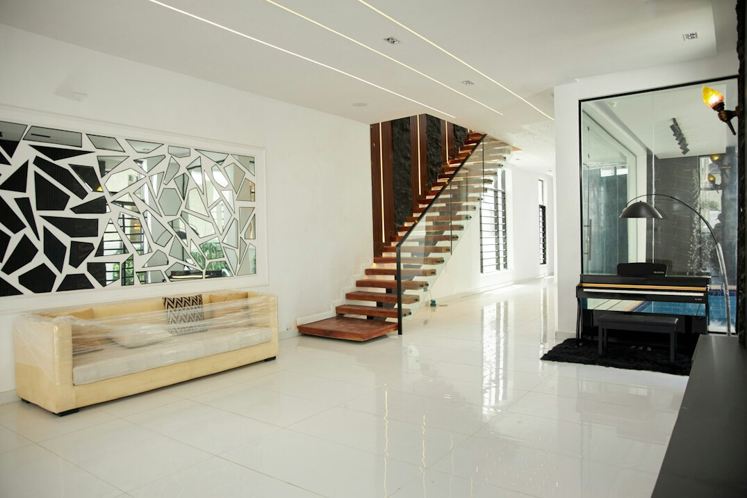 Bright reception area of a modern office with a desk and plants